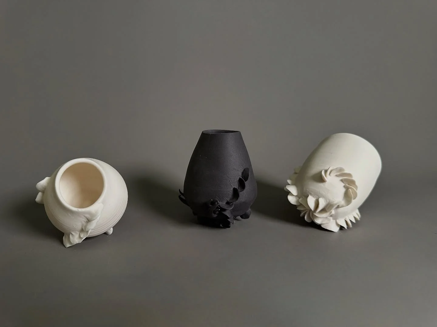 Thrilled that a selection of my mini lichen pots have been chosen for @throwncontemporary Winter exhibition. 

Unglazed and using black and white porcelain, these small thrown vessels have fingerprint embossed growths moving up the sides. As if burie