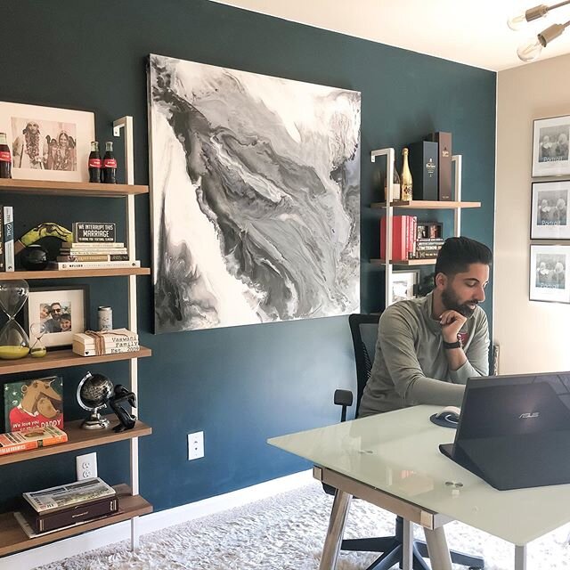 Hubby making an appearance on #thegram! Sharing our makeshift home office to adjust to our new norm. A second-hand desk, rug from another room, art stored in the garage, friday night paint session, and a light fixture from the green room! #makeitwork