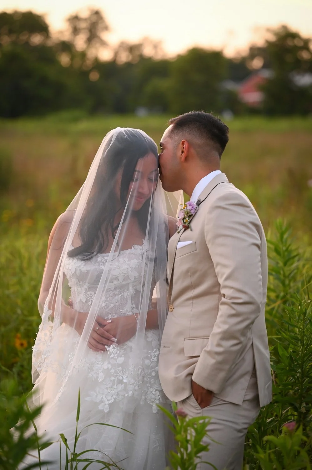 bride and groom in a meadow at Terrain DelVal during golden hour