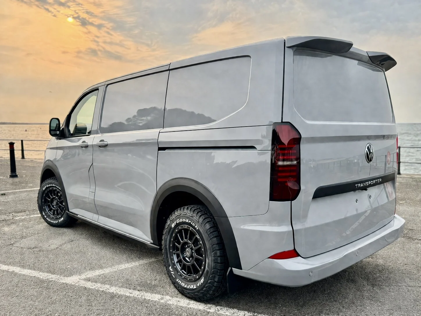 picture of a VW T7 4Motion Sport Line van at sunrise on a quay