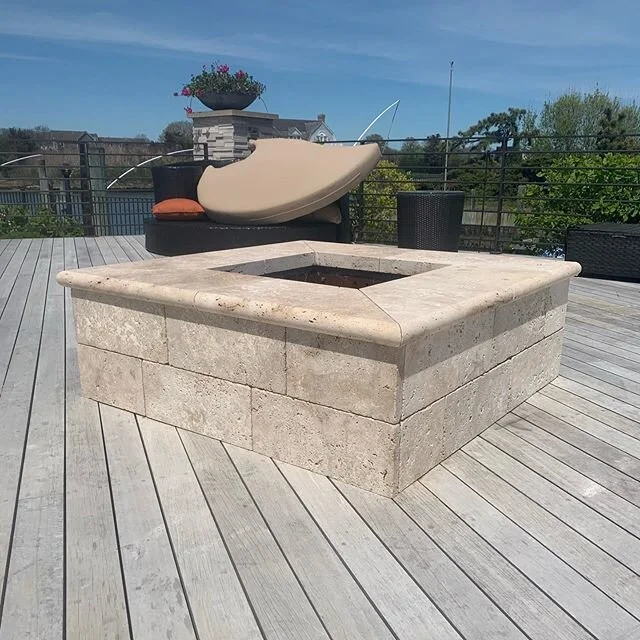 New veneer and bullnose tread caps, existing veneer was a 3D panel stone that cracked, and a pool coping that came loose because of the heat. New travertine with a heat stop mortar joint under the cap to block high temps from getting under the stone.