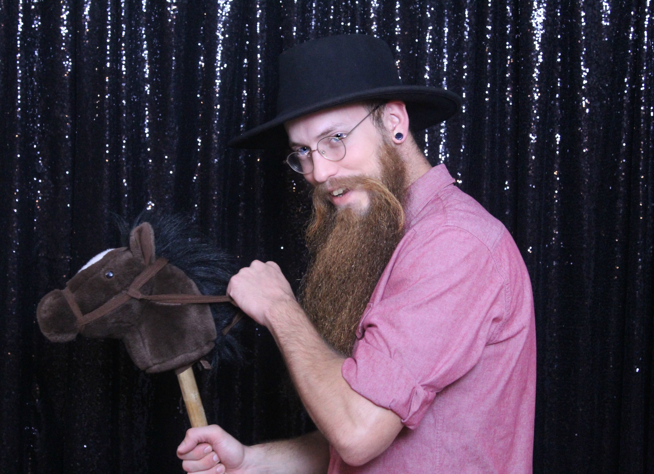 Glitter background and hobby horse prop