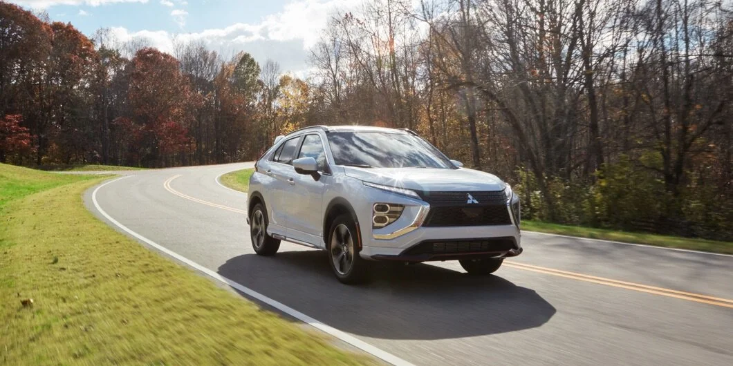 2021-2022-mitsubishi-eclipse-cross-white-front-and-side-profile-driving-road-d.jpeg