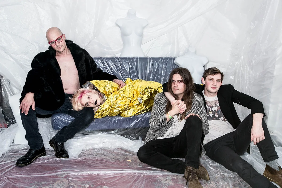 From left—Everyone is Dirty's Christopher Reece Daddio, Tyler English, Sivan Lioncub and Jake Kopulsky—wrapped in plastic by Jazmine Schwinges-Williams at Oakland's The Bad Seed; photographed by Ginger Fierstein.