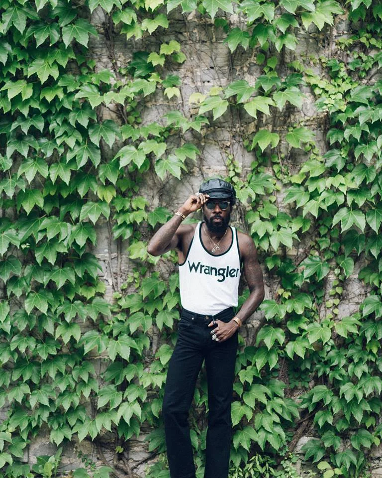 Styling in front of the foliage with Boulevards' Jamil Rashad; press photo courtesy of the artist.