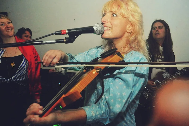 Commanding the strings with Sivan Lioncub; photographed by Denis Perez.