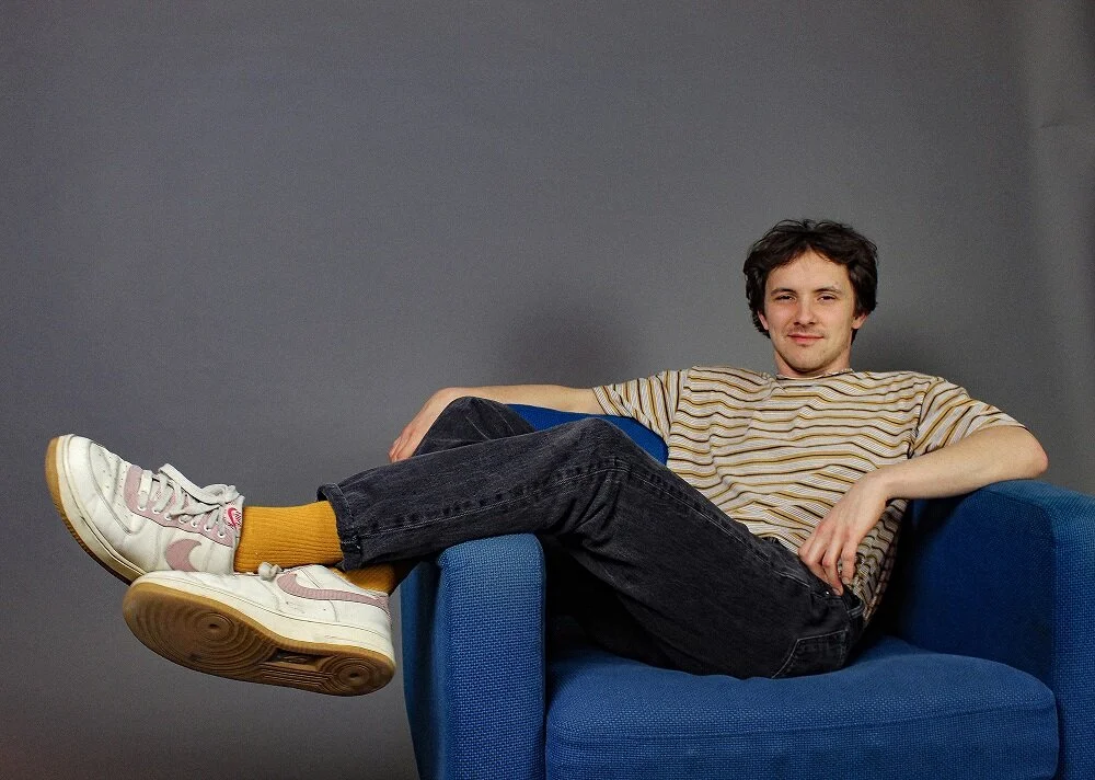 Kicking it on the comfy seat with New Love Crowd’s Travis Swinford; press photo courtesy of Drew Price.