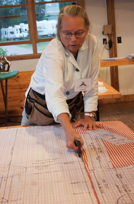 SS Work Shirt Carol demonstrating cutting.png