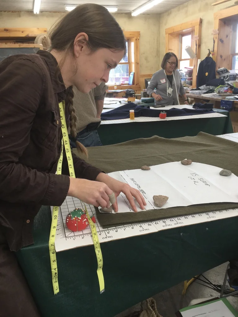 Cutting blanket shirt with stone weights.jpg