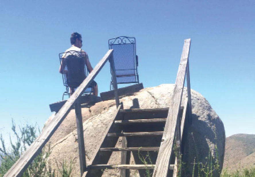 Stairs lead to chairs fastened to a boulder on the Clevenger Canyon South trail.