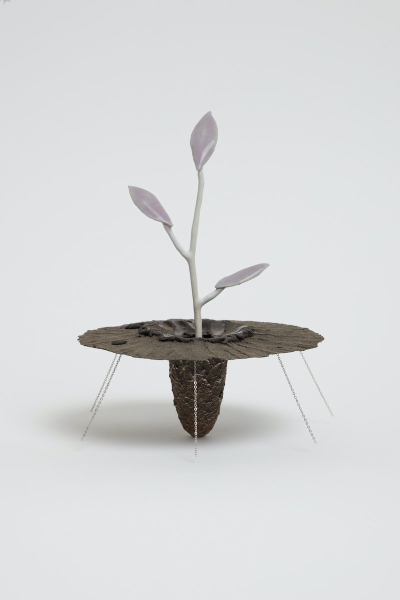   Obelisk (Lavender Pallor Mortis) , 2021. cremated leaves, rare earth elements, ceramic, twig, silver, magnets, resin, steel, glass, maple, walnut. 
