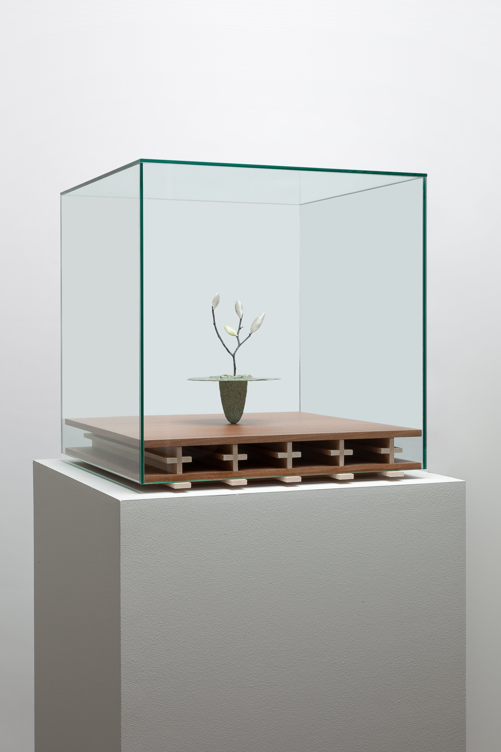   Obelisk (Hypoxia) , 2024. cremated leaves, rare earth elements, ceramic, twig,resin, steel, mahogany, maple, glass.  