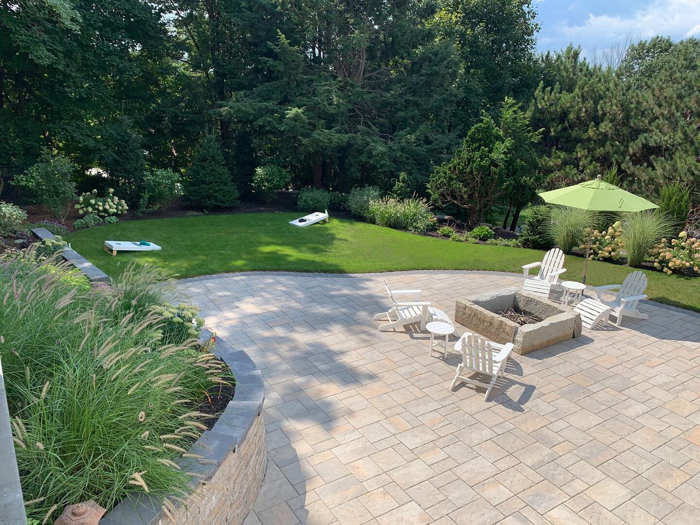 There is always a story behind our work! 

What started as a pool decking and planting project ended in this beautiful patio, firepit and lawn transformation.

Upon digging our team discovered the wood framing of the pool had rotted and was getting r