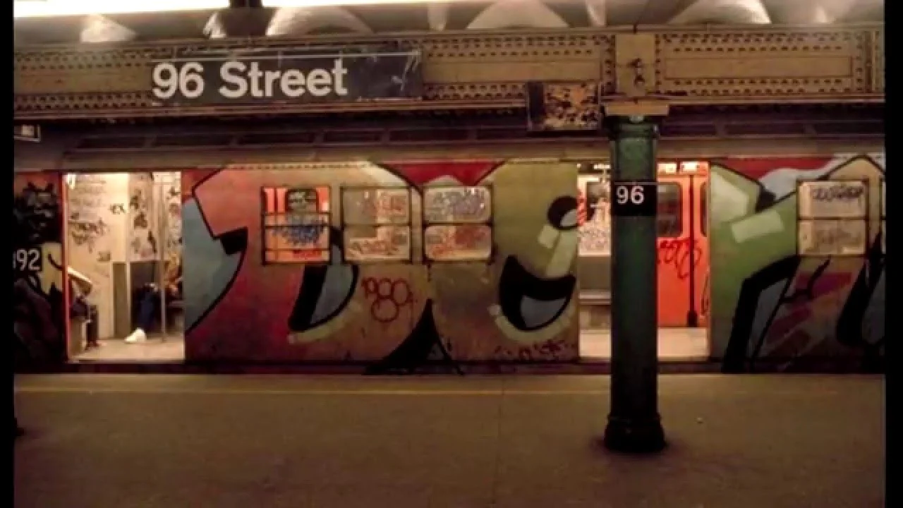 A whole subway car "burner" done by Dondi White juxtaposed with NYCTA signage.