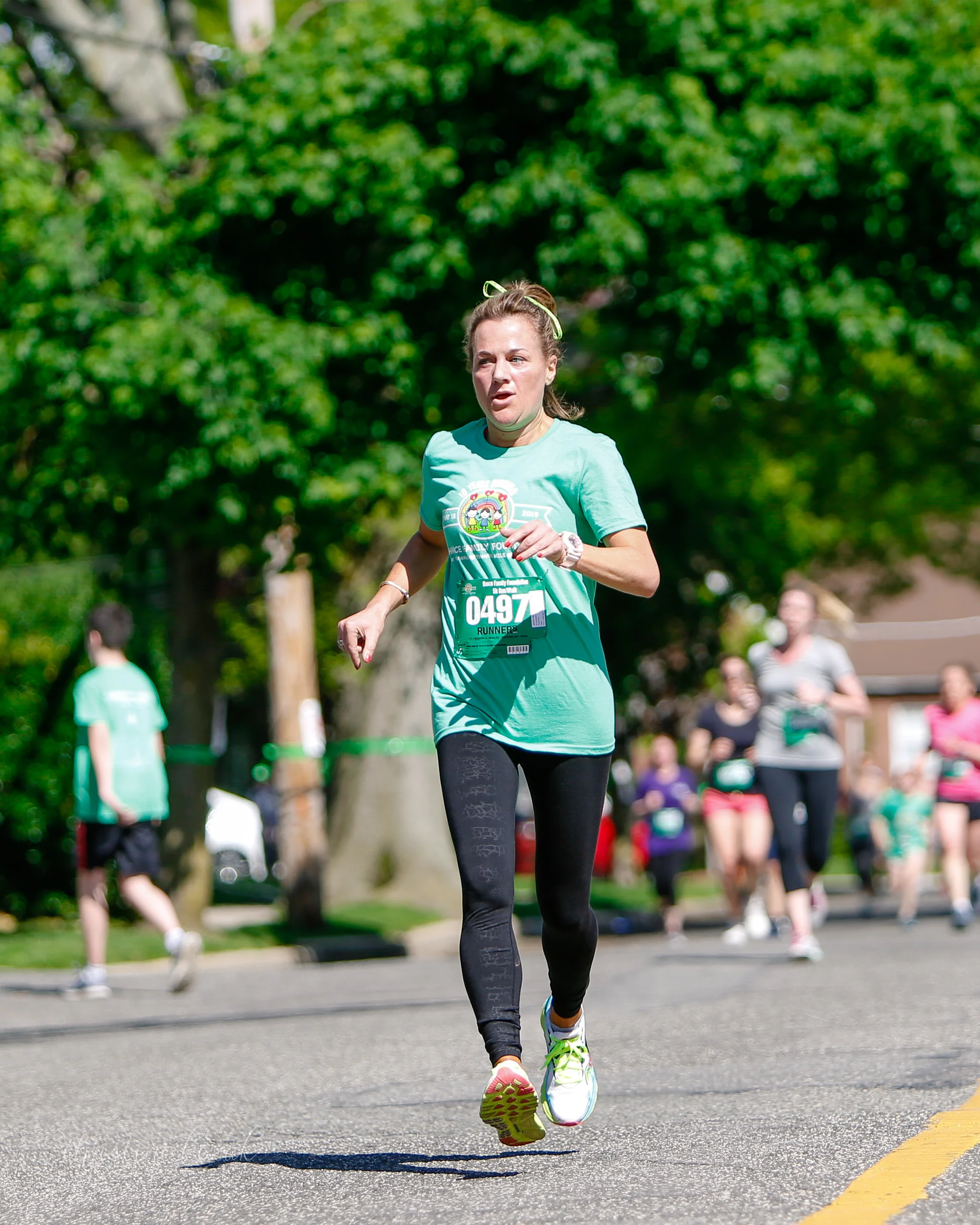 Jackie running in the 5K in honor of Emma, Alyson & Katie