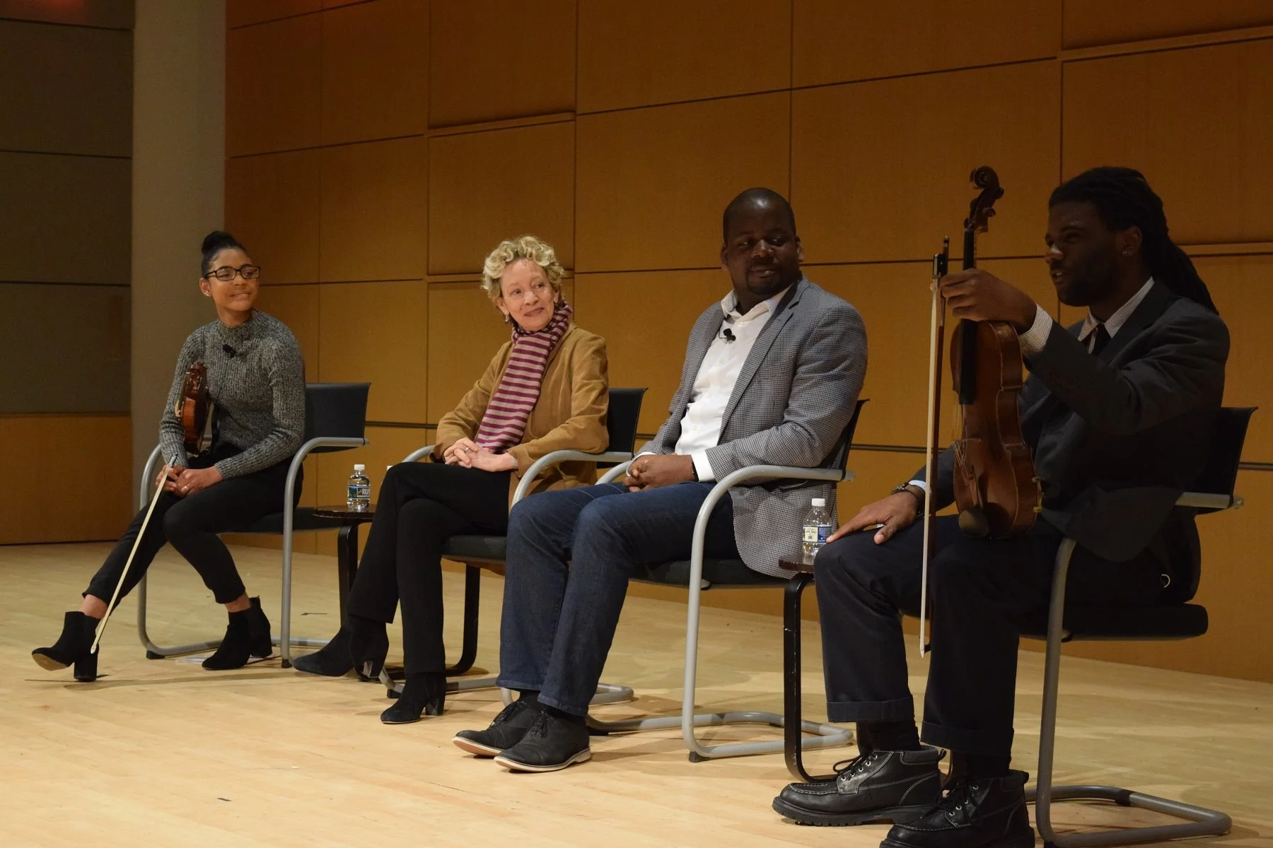 At a screening of CRESCENDO: The Power of Music at National Museum of American Jewish History. Pictured here with Stanford Thompson, Founder and Executive Director of Play On Philly , along with two stars of the film, Zeb and Raven. Photo courtesy of Stanford Thompson.