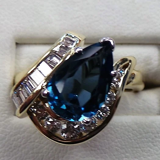 Original ring with thin shank and prong set blue topaz