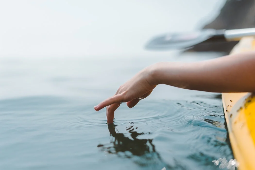 Kayaker touching water.jpg