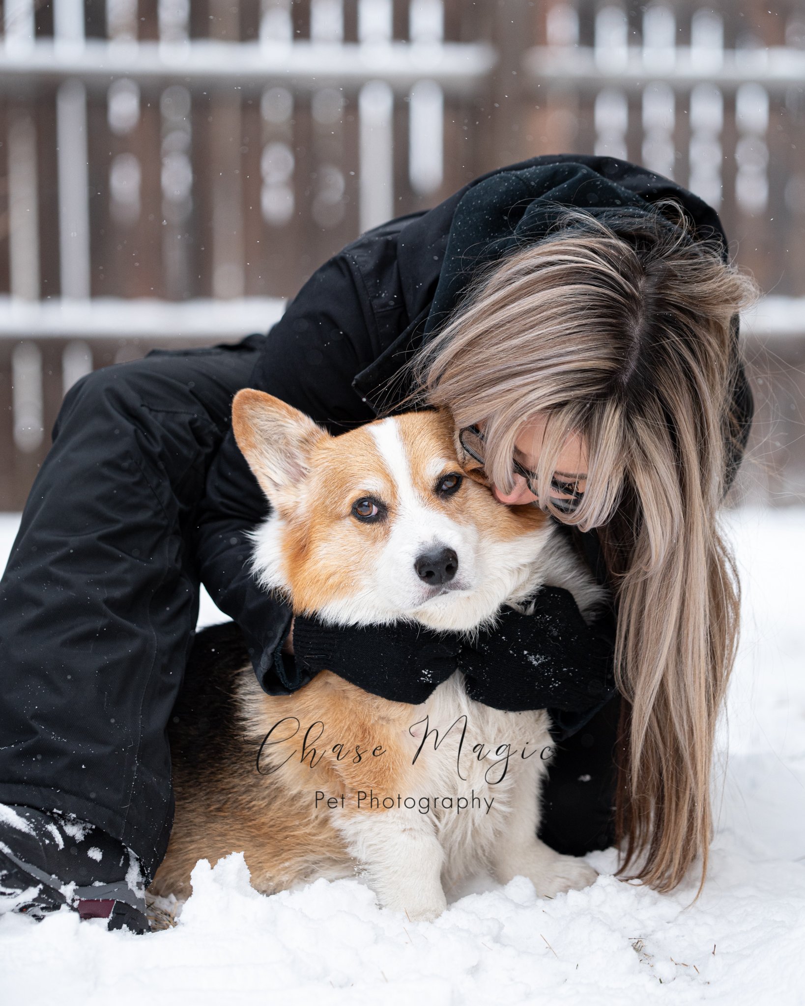 Crogi and a women enjoying the snow and getting kisses