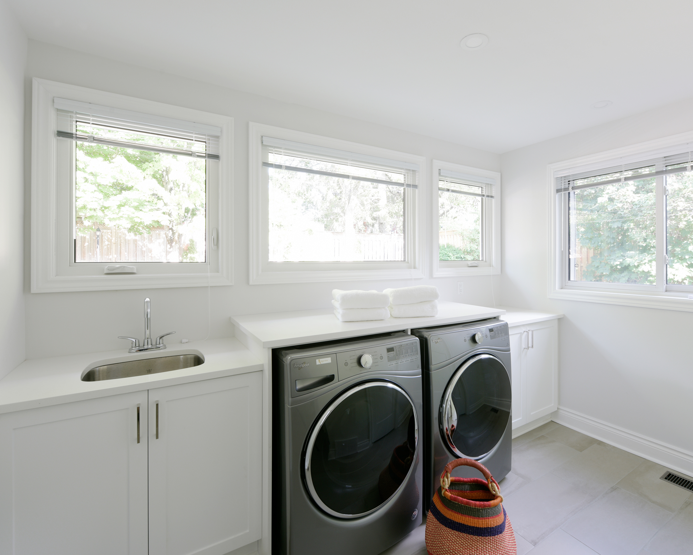 stacey-price-design-interior-decorator-ottawa-laundry-room-white-renovation-folding-area-bright-modern (26).jpg
