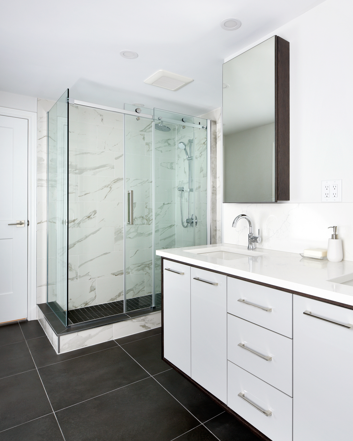  Large custom shower featuring Calcutta marble tile 