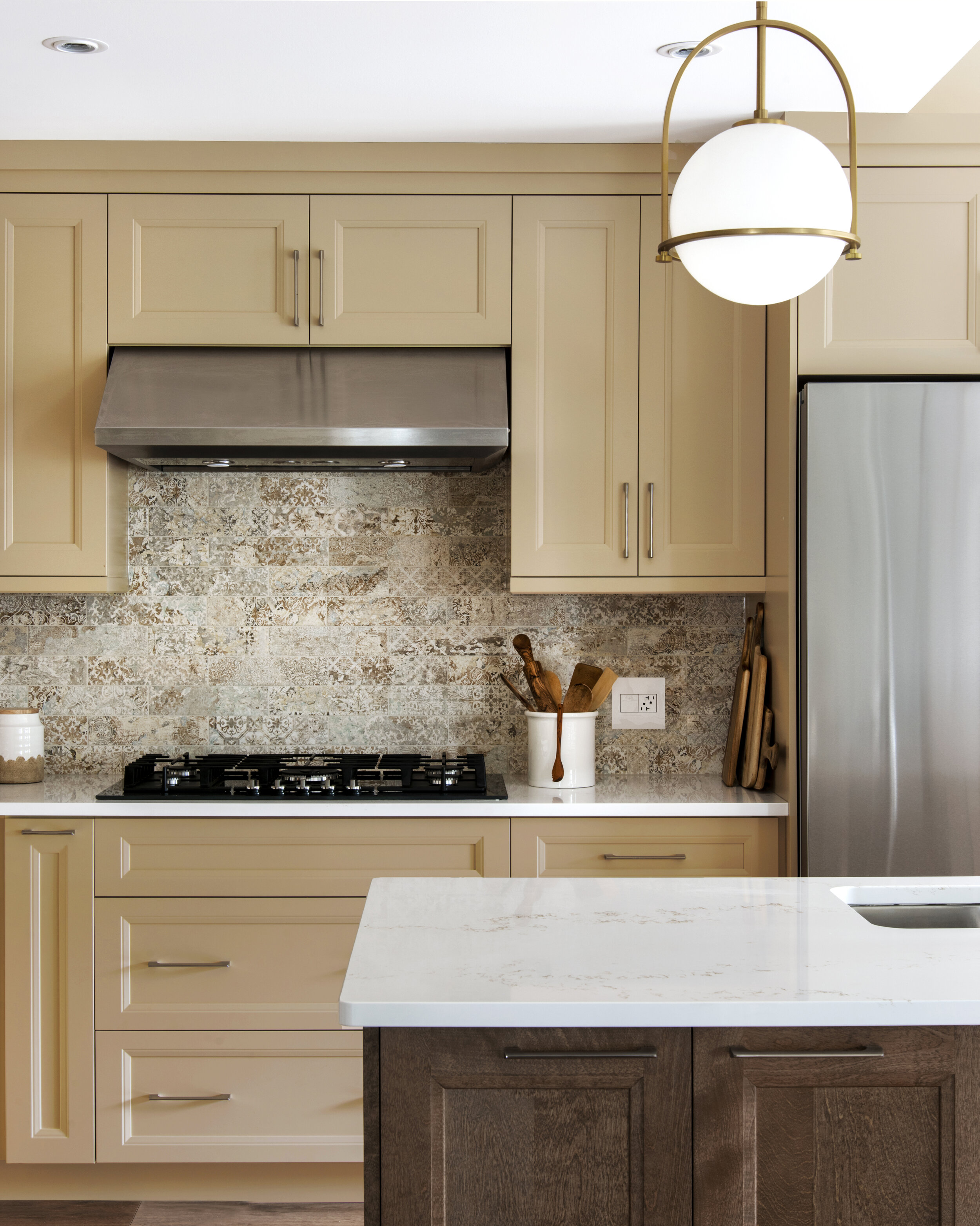  Unique design elements in the backsplash tailored to this family’s style. 