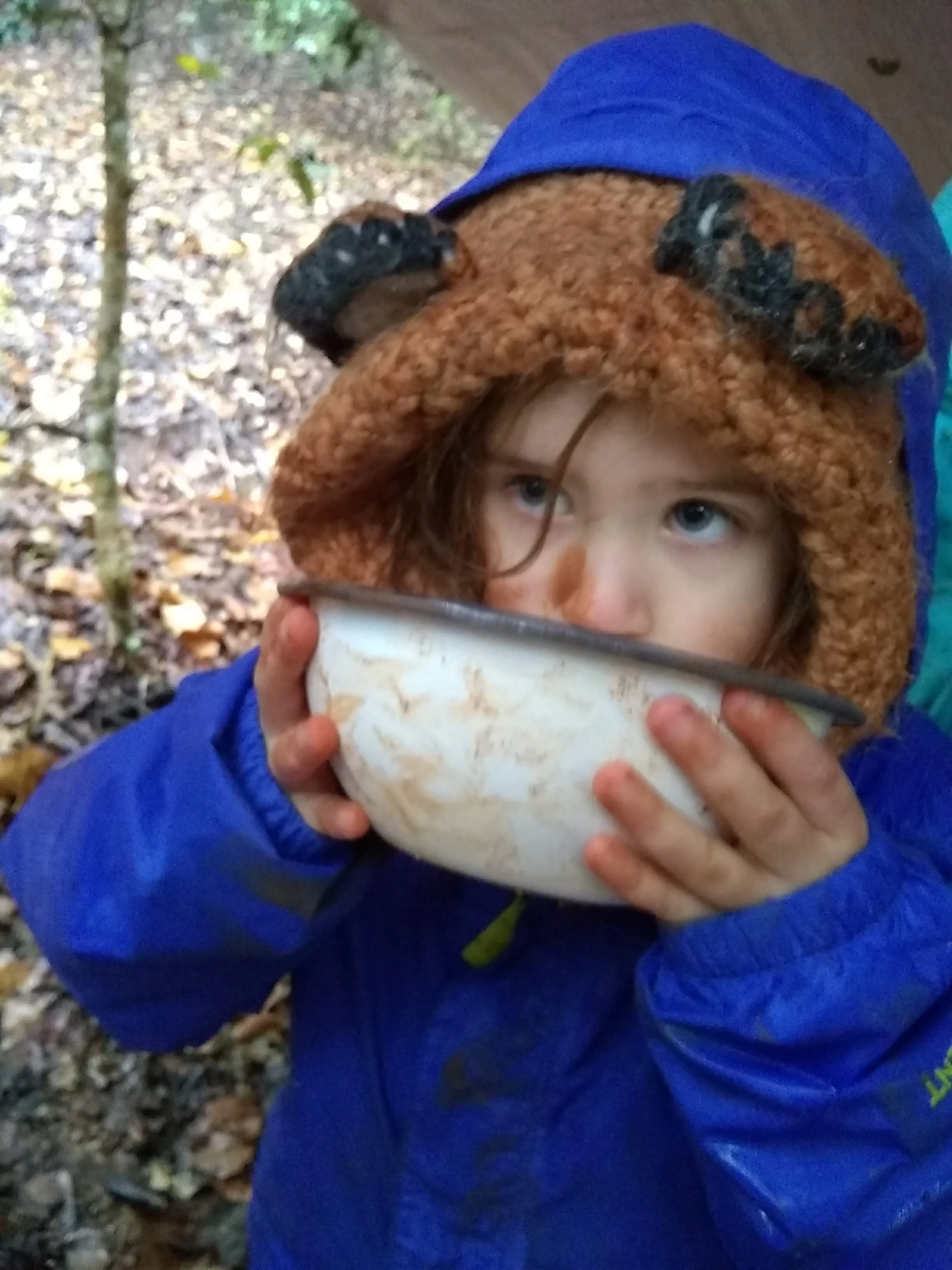 Isla warms up with a bowl of tea.