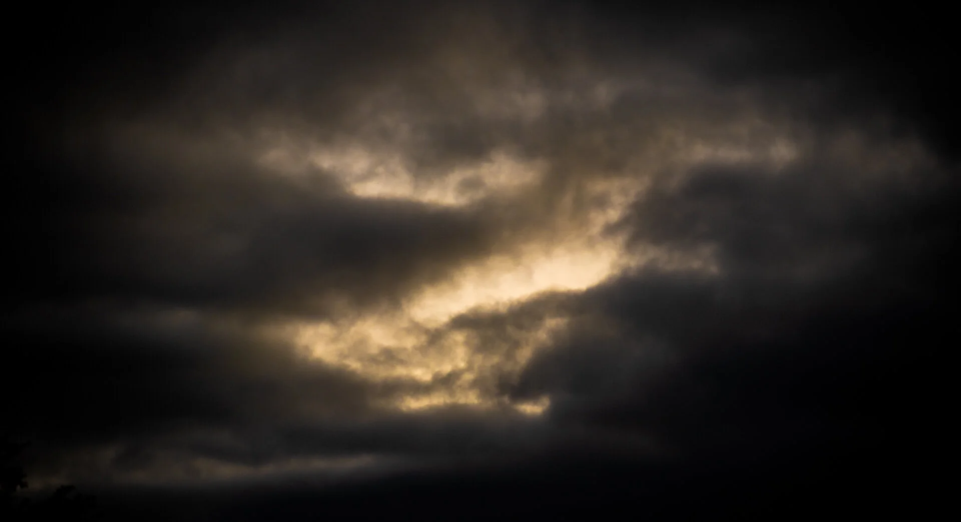 6th April 6:14 pm. The golden light of sunset breaks through the storm clouds.