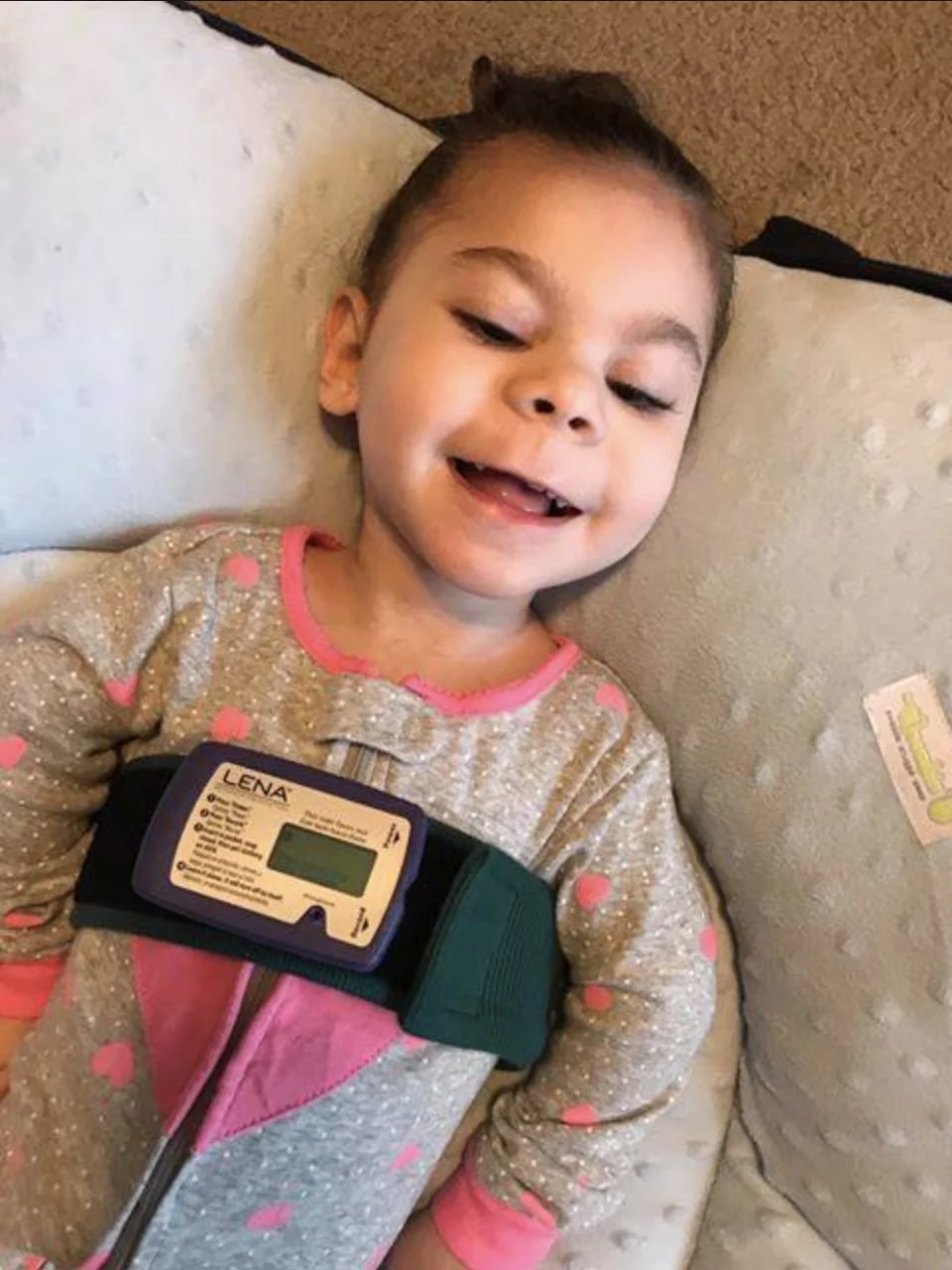 Makenna Loyd, wearing the LENA audio recording device.