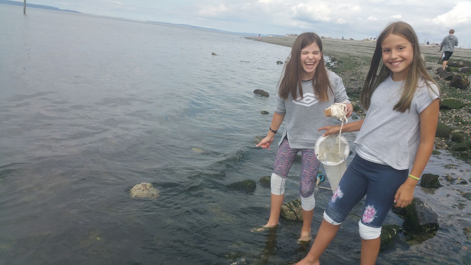 5th graders, Annabelle and Aubrey, fishing to compare plankton from freshwater and saltwater in Edmonds, WA