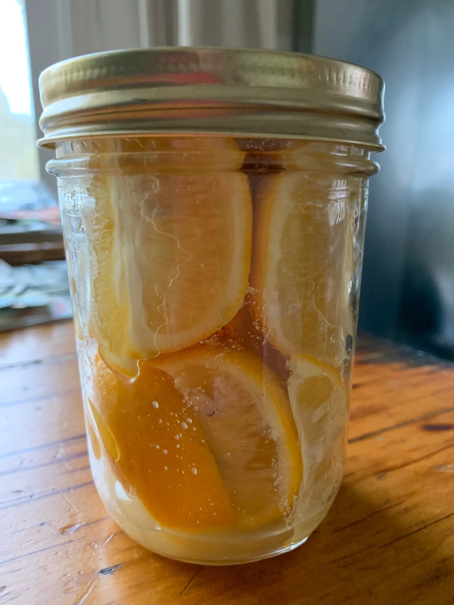 The first day in the jar. Pack the jar with lemon quarters and salt. Top off with lemon juice after the 2nd day.