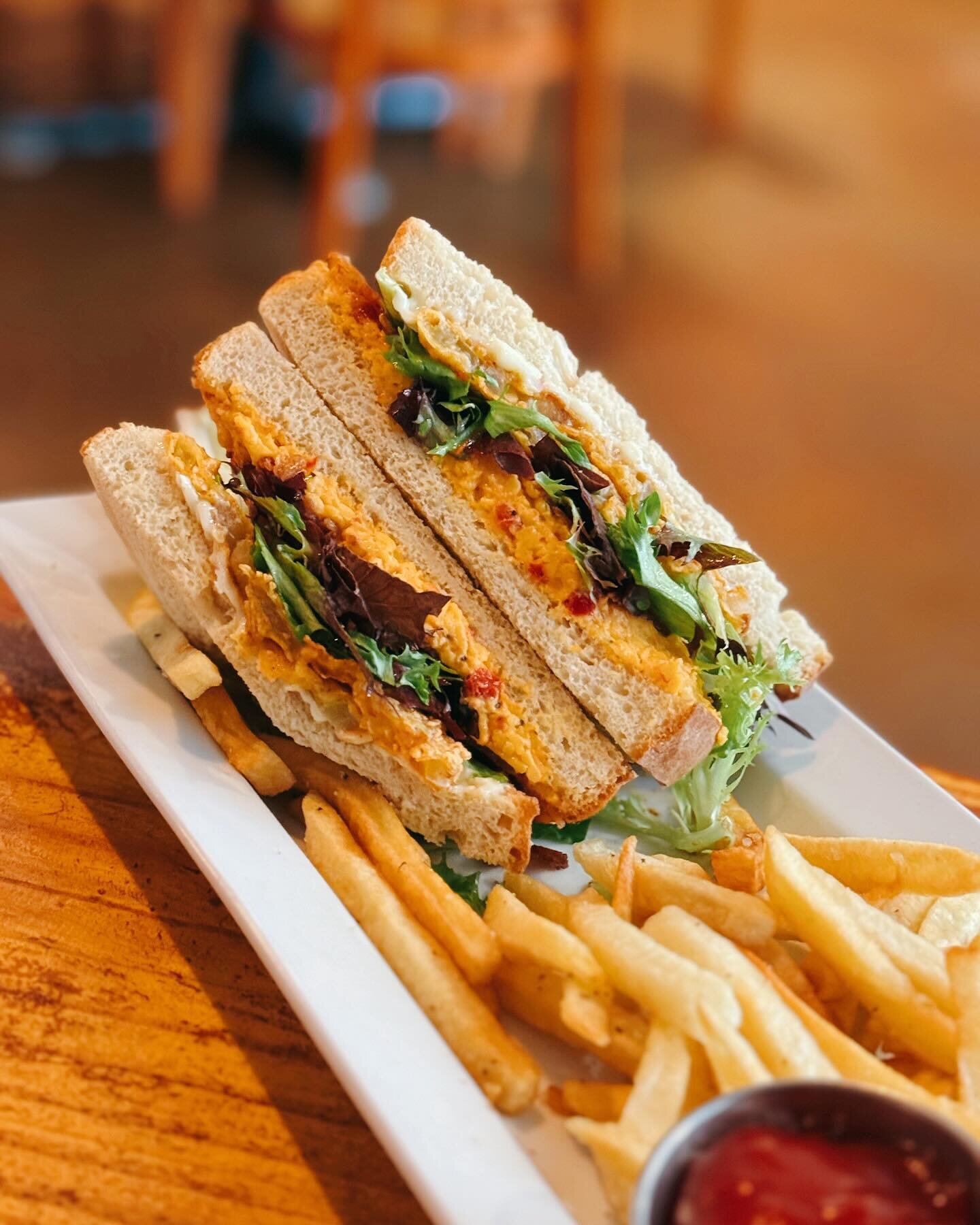 Stop By &amp; Enjoy One of Our Lunch Specials! &bull; The Fried Green Tomato BLT 🍽️ Layered with Housemade Pimento Cheese, Applewood Bacon &amp; Mixed Greens and Served with Housecut Fries! ✨ Open 11AM to 9PM!