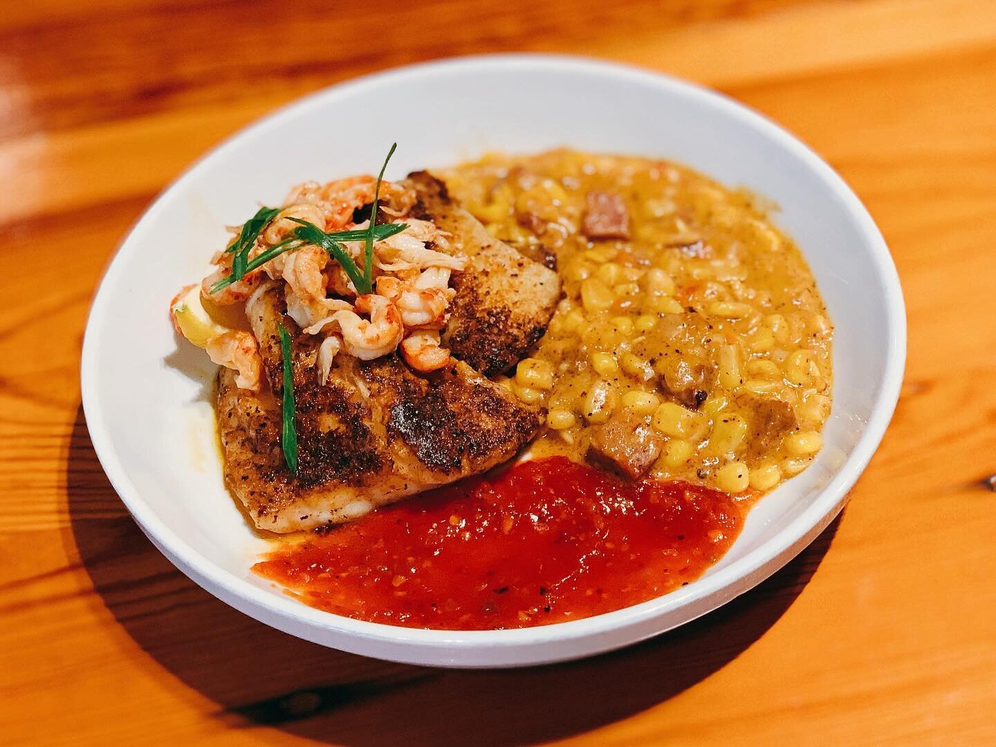 Dine with Us &amp; Enjoy Our Cajun Grouper! &bull; Blackened Grouper over Corn Maque Choux &amp; Red Pepper Coulis and topped with Crystal Crawfish Tails &amp; Green Onions! 🍽 Open 11AM to 9PM!