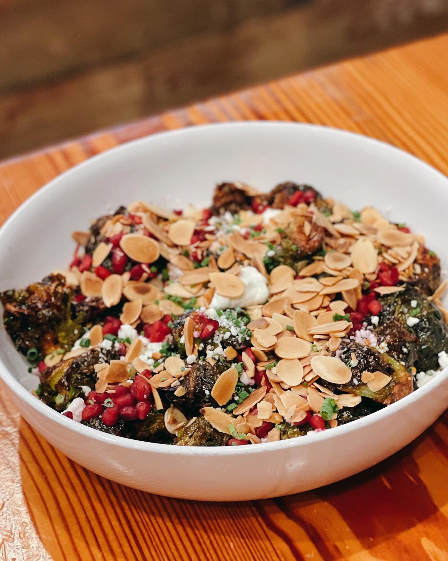 🍽️ Dine with Us &amp; Try Our Sweet-Chili Glazed Brussel Sprouts topped with Goat Cheese, Toasted Almonds &amp; Pomegranate Seeds! ☀️ Open 11AM to 9PM!