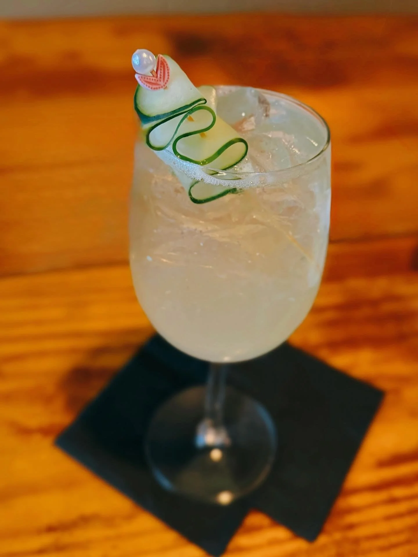 In Need of a Refreshing Cocktail? ✨ Try Our Signature Cucumber St. Germain! &bull; St. Roch Cucumber Vodka &amp; St. Germain Liqueur with Muddled Cucumber, Housemade Rosemary-Infused Simple Syrup, Champagne, Soda Water &amp; Lime and Topped with a Cu