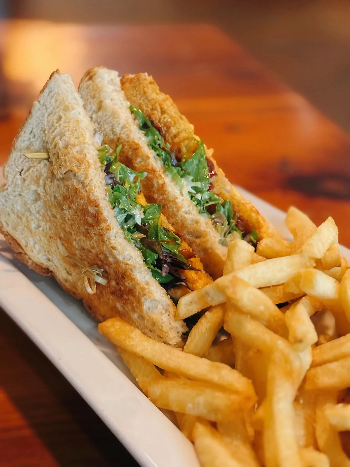 One of Our Lunch Specials &bull; The Fried Green Tomato BLT &mdash; Layered with Housemade Pimento Cheese, Pecan-Smoked Bacon &amp; Mixed Greens and Served with Housecut Fries! 🍽 Open 11AM to 9PM!