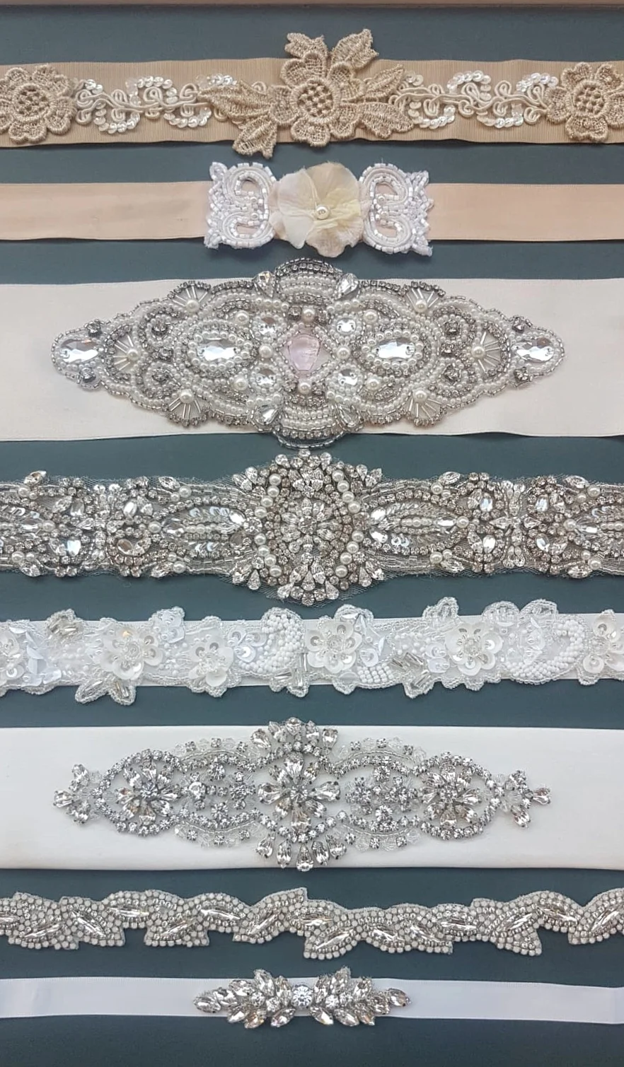 Sashes What better way of adding a touch of sparkle or colour than by adding a sash. It will define your waist and add extra interest to your dress. Our collection of new and bespoke sashes offer so much choice. We’ll help you pick the best style to suit your dress, whether it’s simple, fun, elaborate or chic. If we don’t have what you’re looking for, we can create one just for you. A fabulous option if you are looking to work in your bridal party colours!