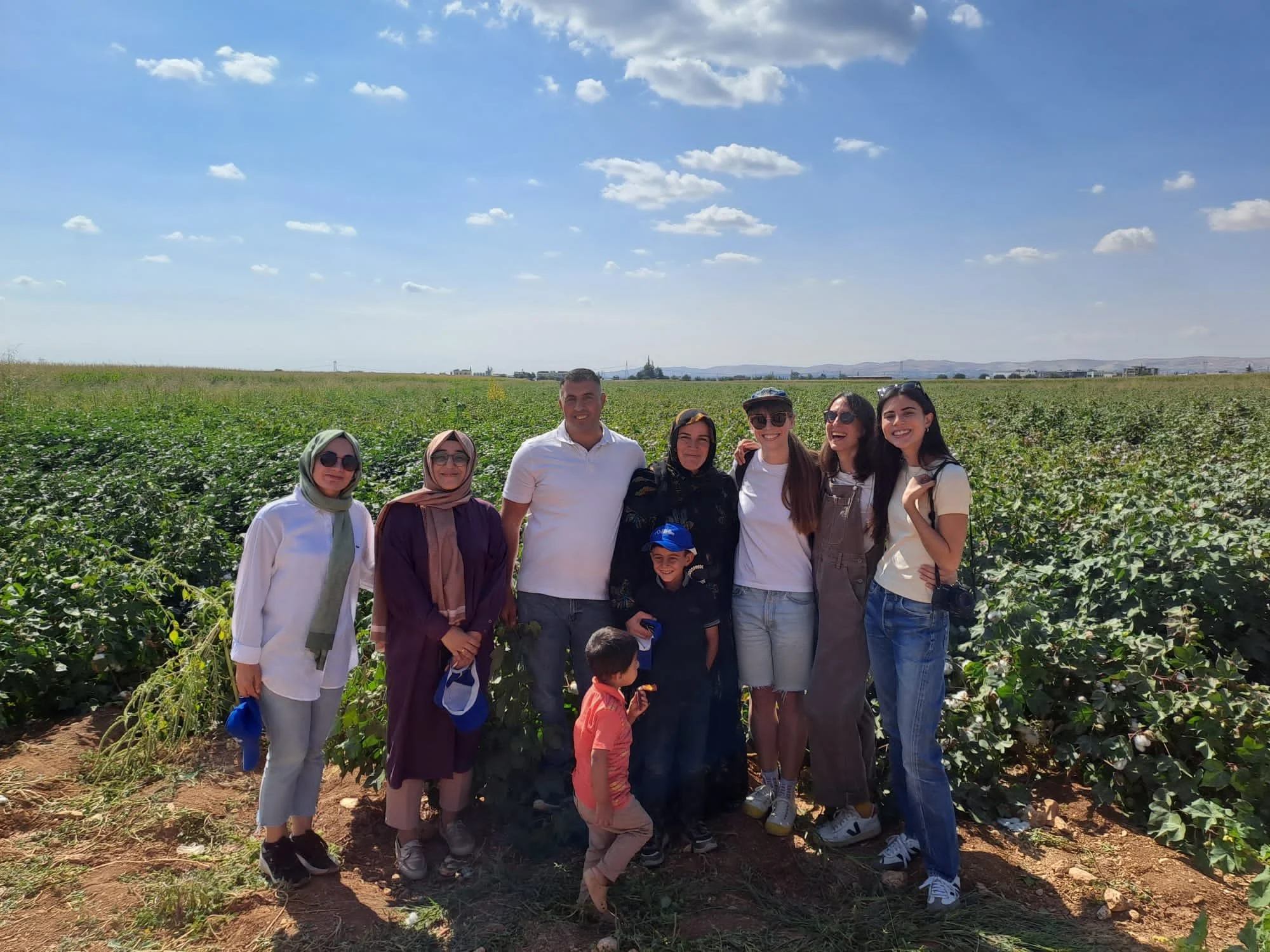  Anne, Marzia and Ani from Cotton Diaries (on the right), visiting Esmee and Ismail’s cotton field (centre) along with ladies from IPUD (left), Şanlıurfa, Türkiye, 2023 