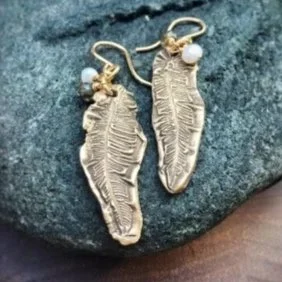 feather-earrings-on-rock---wood.jpg