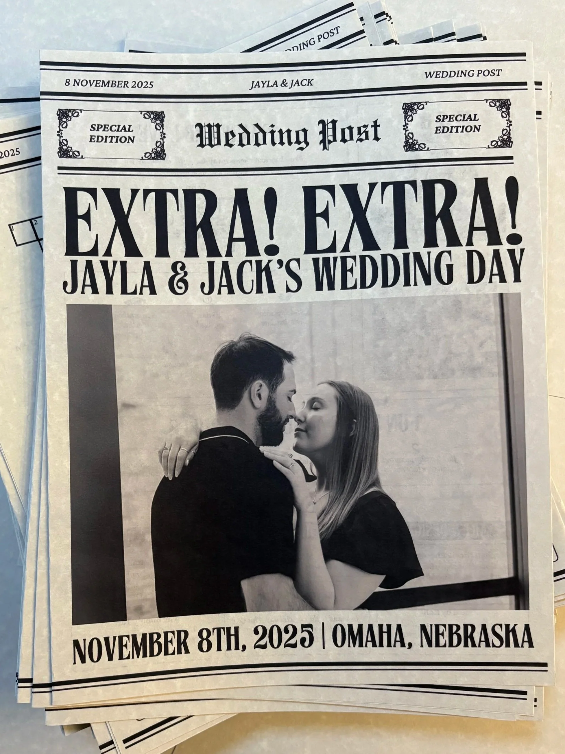 Black-and-white newspaper announcing Jayla and Jack's wedding on November 8th, 2025 in Omaha, Nebraska, with a photo of a couple embracing.