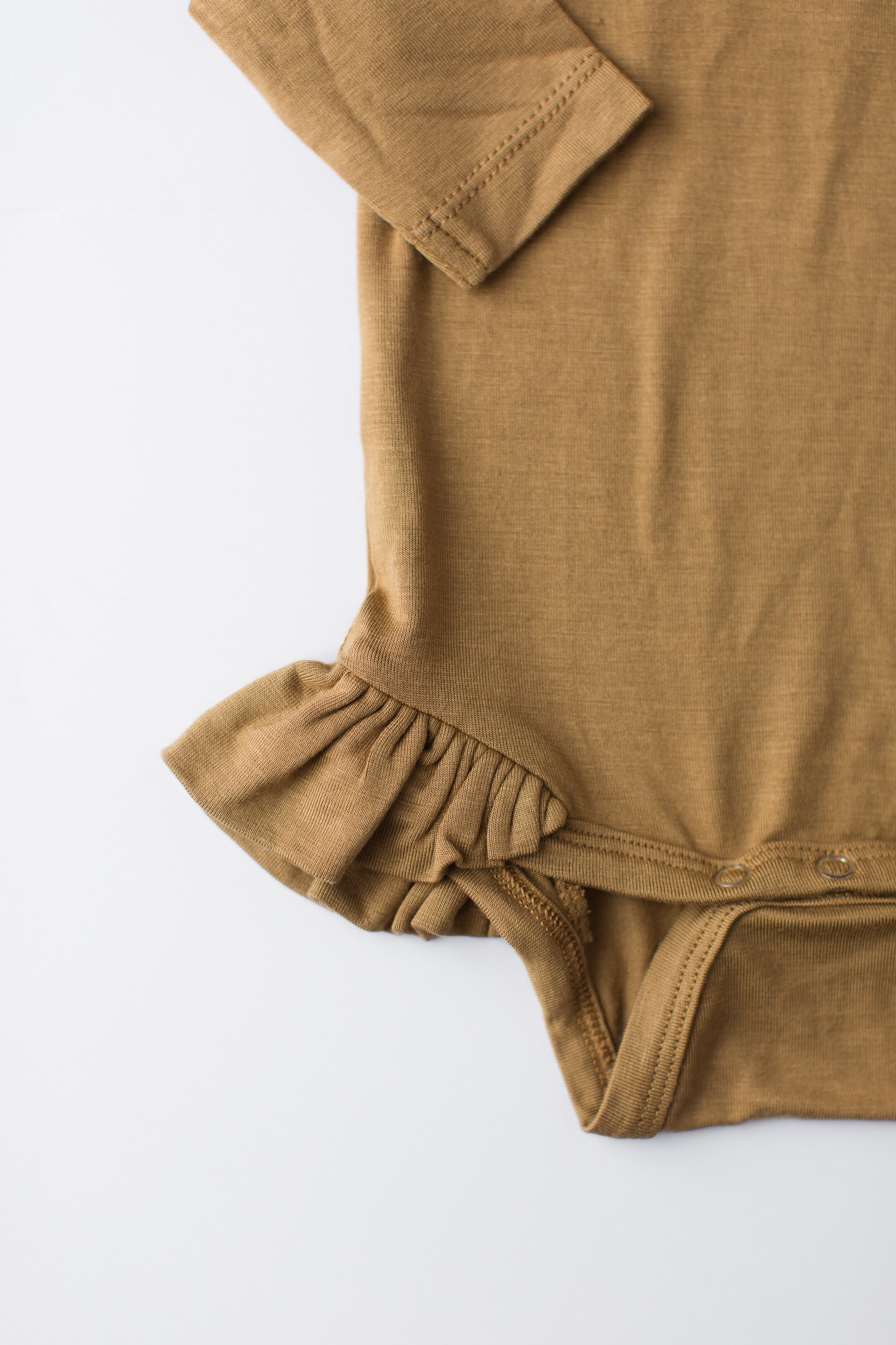 long sleeve bamboo ruffle bodysuit | dijon | detail
