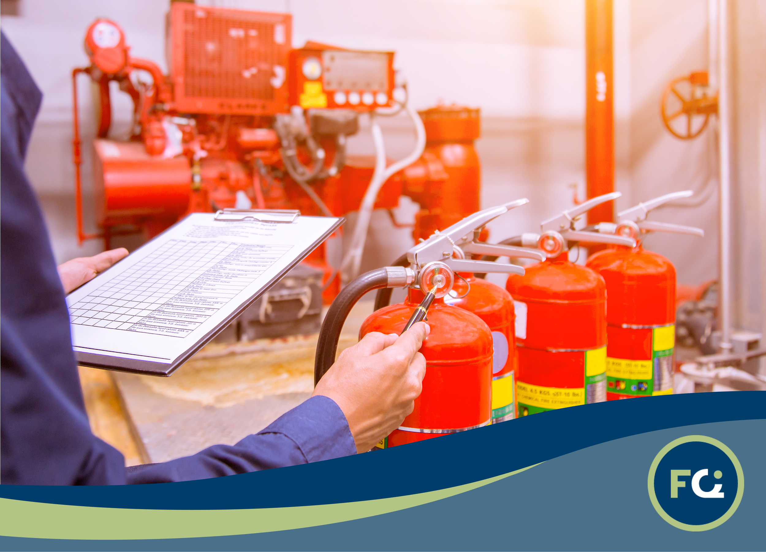 A person holding a clipboard and inspecting fire extinguishers in an industrial setting, with fire suppression equipment in the background.