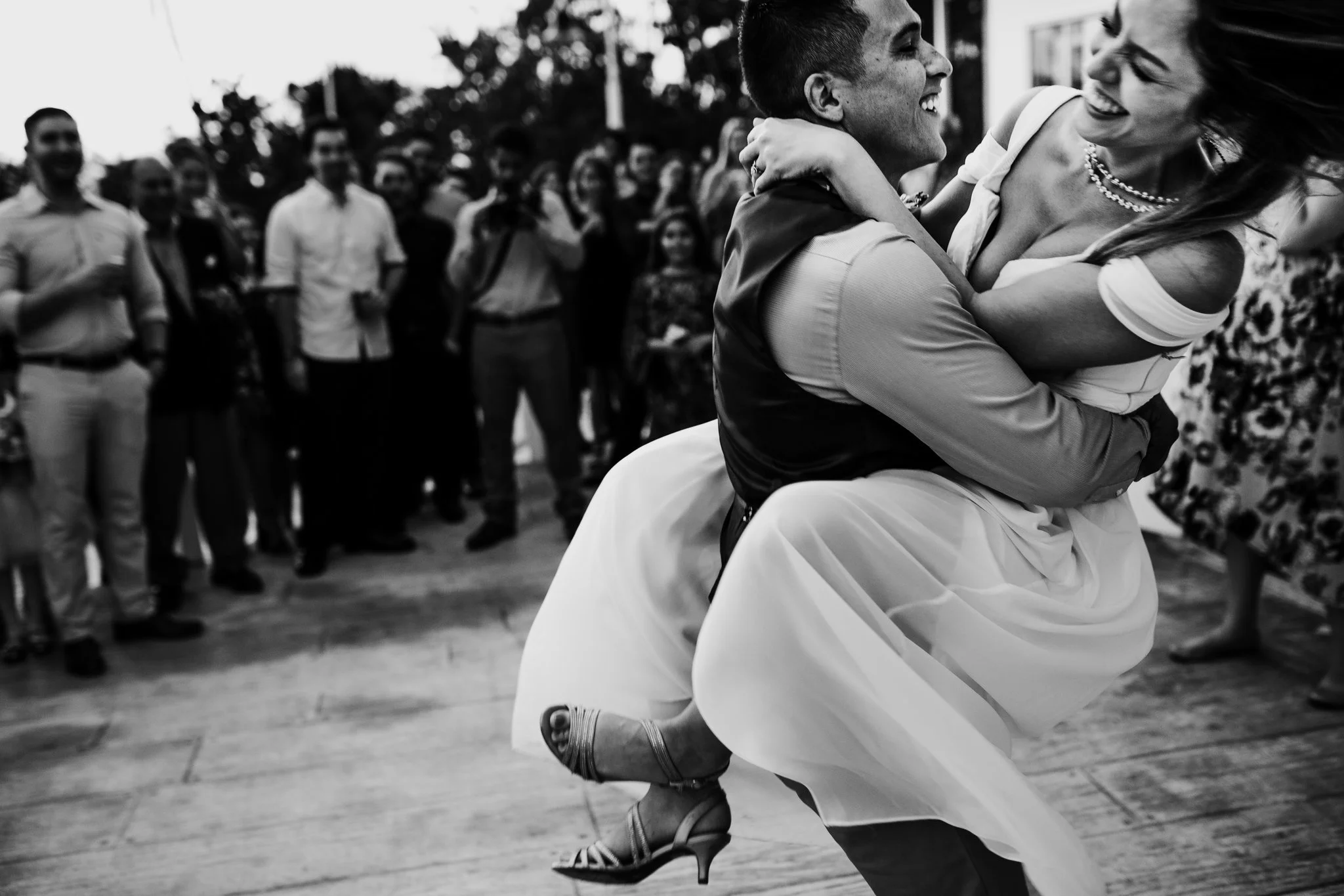 Groom sweeps bride off her feet during first dance