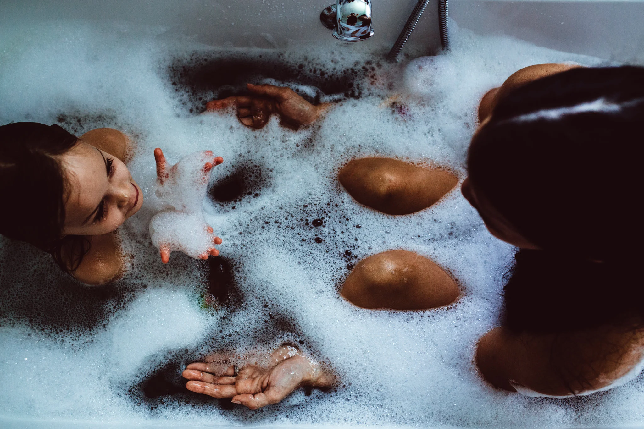 Mom and Toddler in bathtub during a sweet motherhood moment