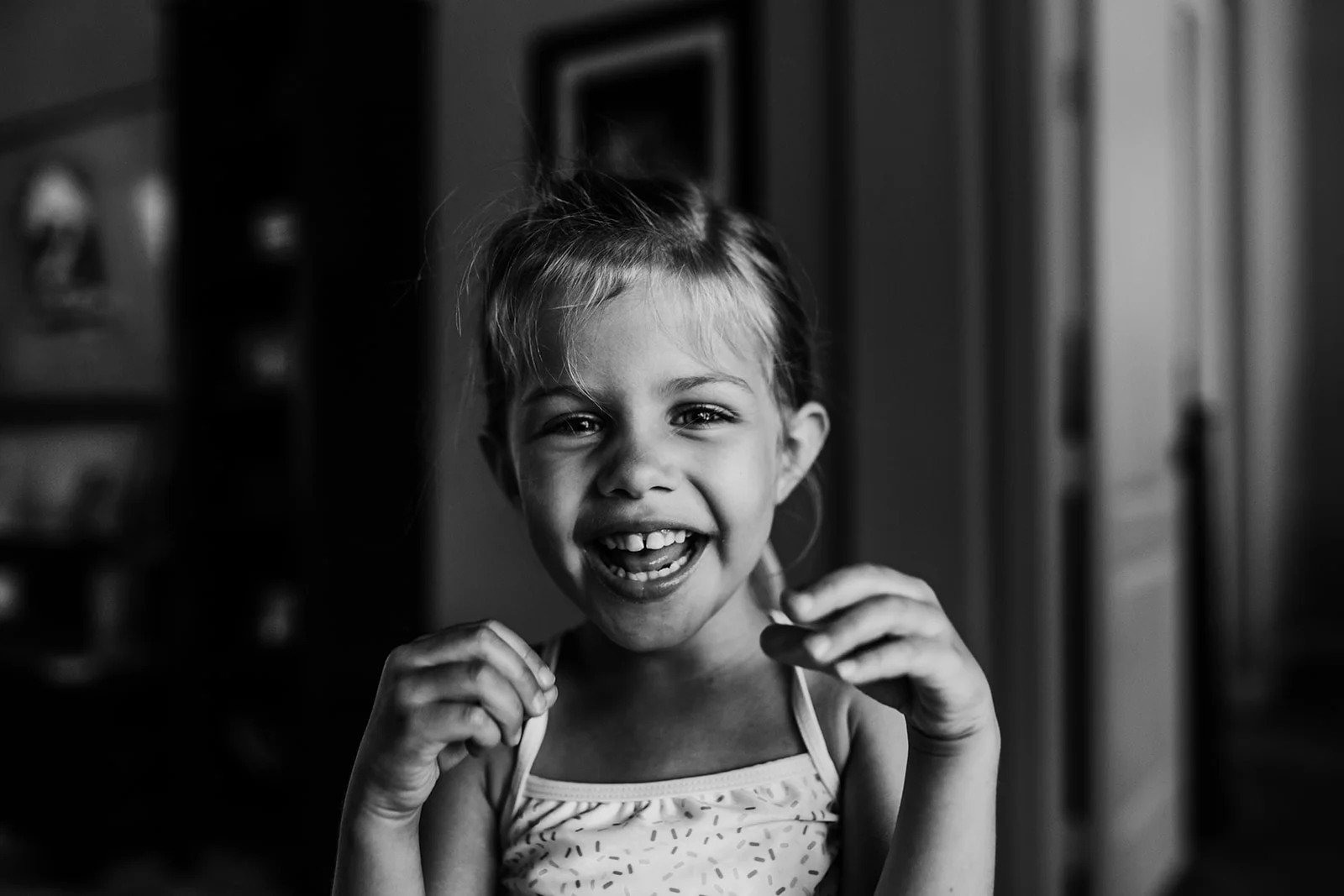 little girl smiling big 