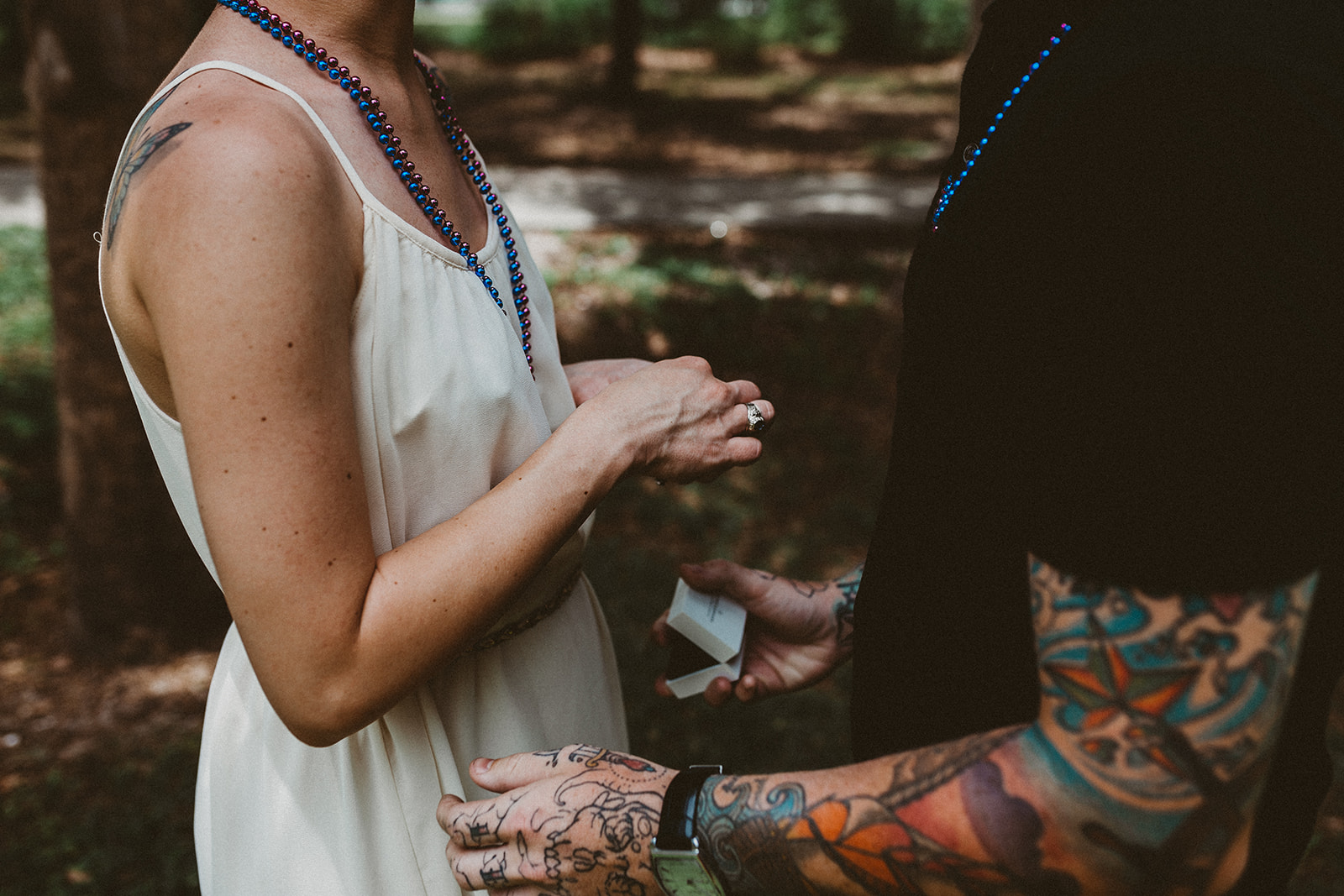  Girl looks at ring after surprise Three Oaks Park proposal 