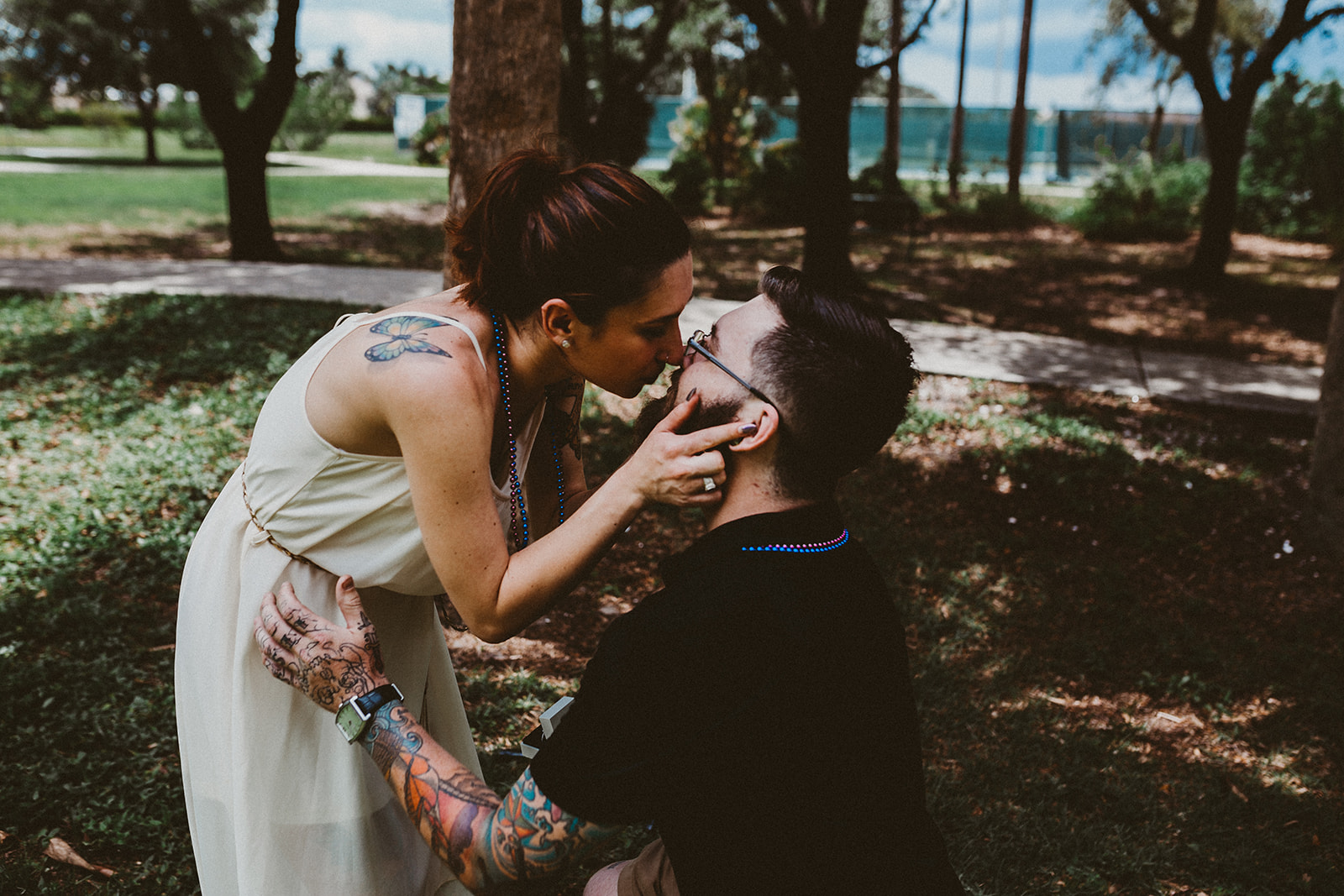 Couple kiss after proposal at Three Oaks Park
