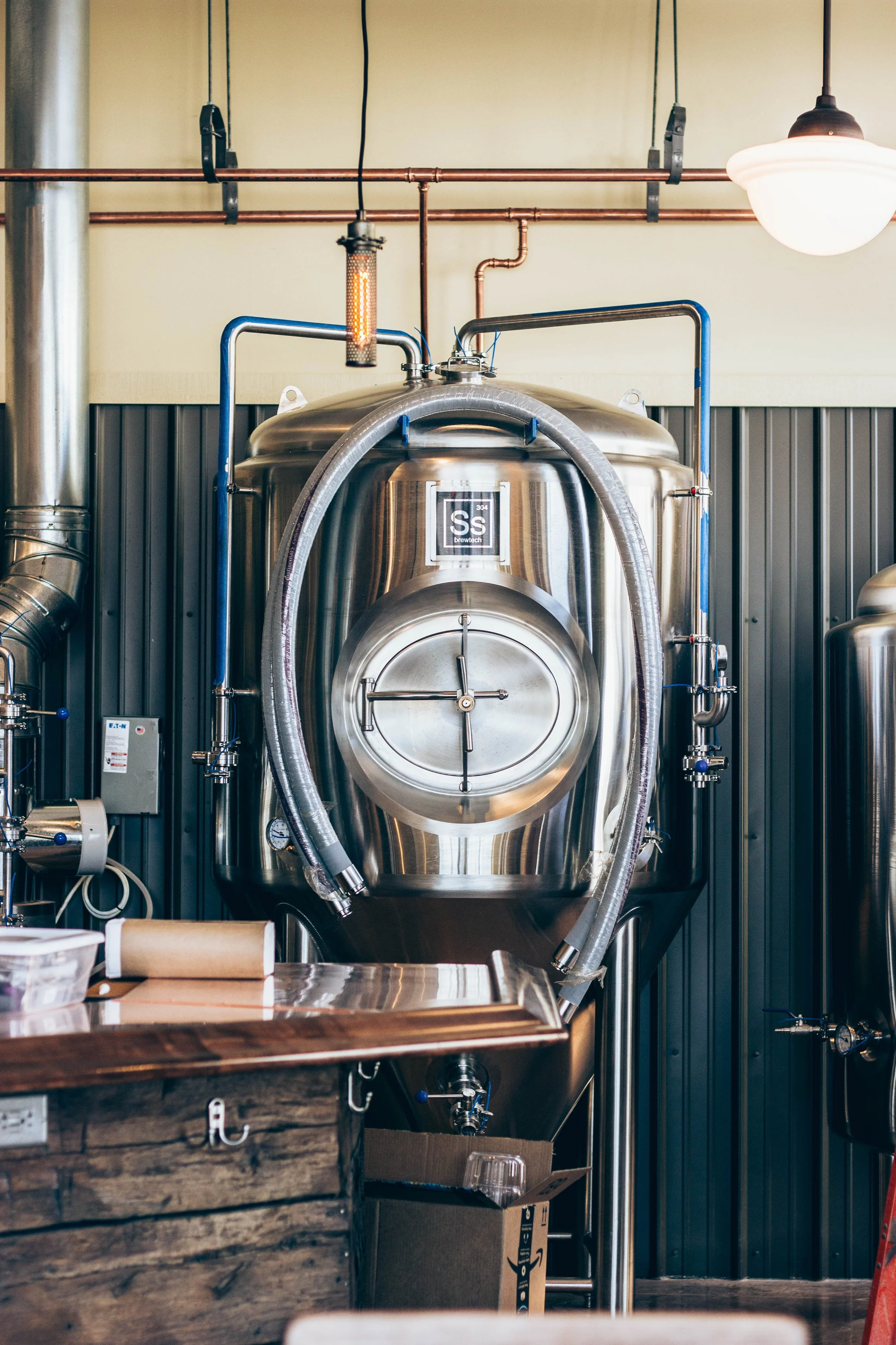 Enjoy something to eat and a fresh-brewed beer as you watch your next favorite chugging away.