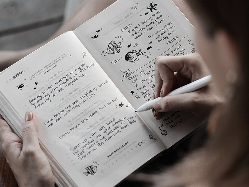 Woman writing in a journal