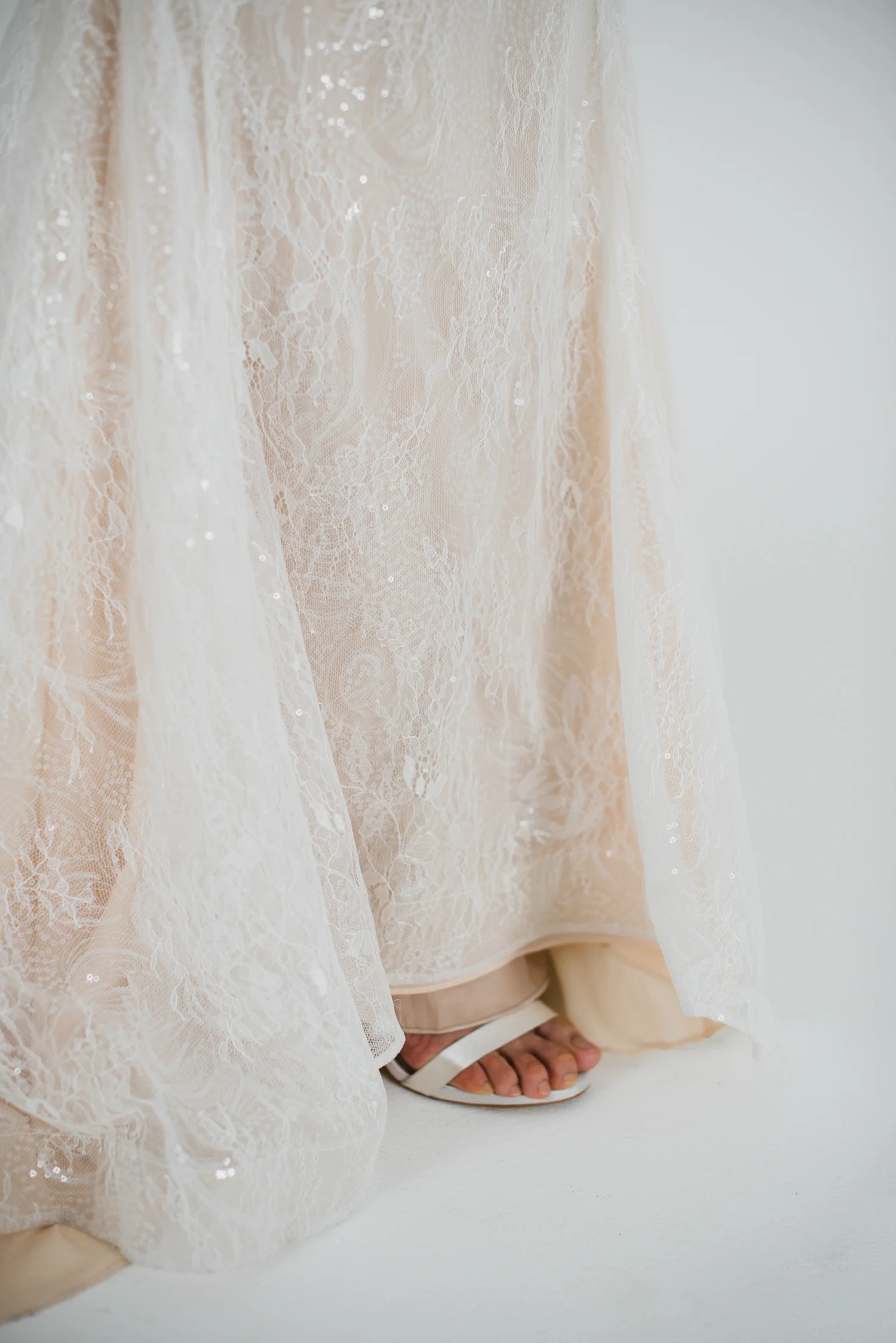 Thea gown peach toned wedding gown with plunging neckline and floral lace details